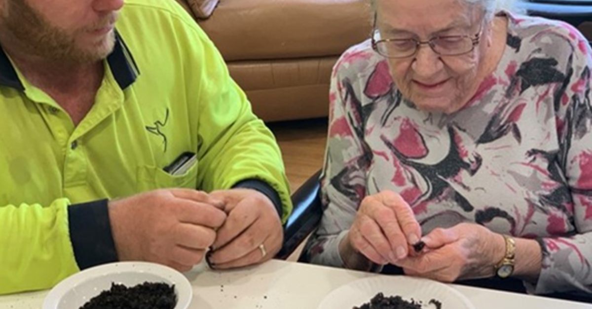 Retirement village takes up seed bombing to replenish areas devastated by bushfire